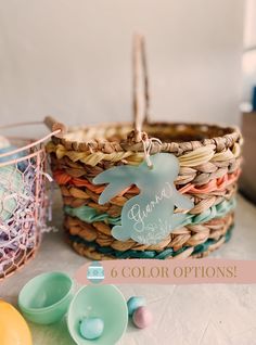 a basket filled with lots of different colored eggs next to other items on a table