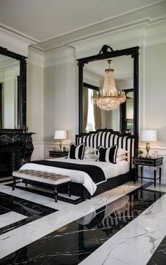 a bedroom with marble floors and black and white decor