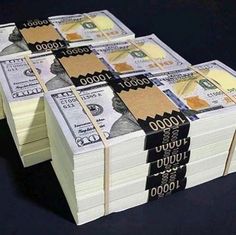 stacks of money sitting on top of each other in front of a black background with the words $ 1, 000 written on it