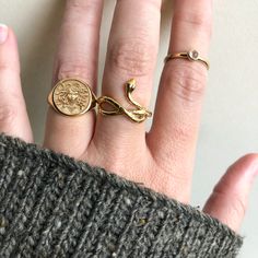 Sizing: Recommended to size up if you are a half-size Metal: 14k Yellow Gold Vermeil Ring Width: 18mm Ring Height: 10.5mm Sizes: Whole sizes 4 to 10 Gemstone: 1.5mm Genuine Brilliant Cut Emeralds Snake Ring Gold, Snake Shedding, Goddess Bracelet, Witch Rings, Astrology Necklace, Emerald Eyes, Forever Gifts, Goddess Necklace, Blood Diamond