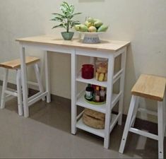 a small table with two stools next to it