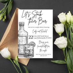 a card with a bottle and flowers on it next to a envelope that says, let's stay there bar