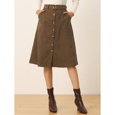 Indulge in a perfect blend of comfort and style with this ribbed corduroy A-line skirt. The high-fitted waist and slightly flared hem add a touch of elegance to the skirt, while the matching waist tie accentuates your curves, creating a flattering silhouette. The elastic waist and belted detail make it comfortable to wear all day long. This versatile skirt is suitable for any occasion, be it a party, a day out shopping, or a day at the office. The midi length adds a touch of sophistication to th High-waisted Brown Corduroy Skirt, High-waist Corduroy Skirt For Fall, High Waist Corduroy Skirt For Fall, Corduroy Skirt For Fall Workwear, Corduroy Skirt With Pockets For Work, Fall Corduroy Skirt For Workwear, Winter Corduroy Skirt With Button Closure, Brown Knee-length Skirt With Button Closure, High-waist Brown Skirt With Button Closure