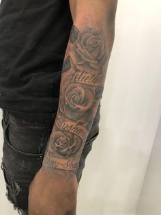 a man with a rose tattoo on his arm