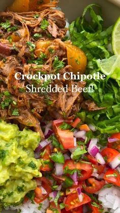 shredded beef with guacamole, tomatoes, onions and cilantro in a bowl