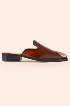 Cognac brown mules shoes with placement bird embossed and stack heels.
Composition: Leather
Color: Brown
Other Details: 
Weight: 2 kgs
Heel height: 0.75 inches
 - Aza Fashions Brown Mules, Men Footwear, Shoes Men, Mules Shoes, Stacked Heel, Aza Fashion, Emboss, Cognac, Brown Leather