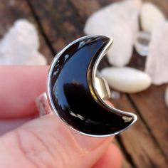 "☾Handmade, Natural Black Onyx Sterling Silver Moon Statement Rings☾ ❤︎Featured in this listing is a sterling silver, handmade, natural stone ring. This lovely ring features a beautiful, Natural Black Onyx Large Moon shaped stone. The Black Onyx Moon has been bezel set into a highly polished, Sterling Silver, sturdy setting. ❤︎Wide gradual band from 4-6mm ❤︎These large 1\" Moons in black onyx have been highly polished, with a rise of 7mm ❤︎Each ring has been hand made, so may vary slightly Stone Mystical Black Ring As Gift, Unique Black Jewelry With Moon Phase, Unique Black Moon Phase Jewelry, Mystical Black Sterling Silver Rings, Black Mystical Ring Jewelry, Mystical Black Ring Jewelry, Black Mystical Style Jewelry Ring, Black Sterling Silver Moon Phase Jewelry, Black Sterling Silver Jewelry With Moon Phase