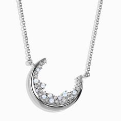 a white gold necklace with diamonds and crescents on the front, set in 18k white gold