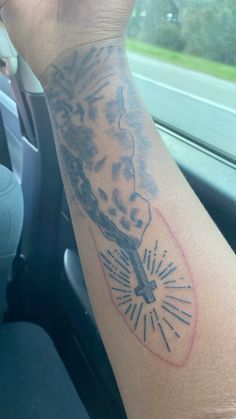 a person with a clock tattoo on their arm