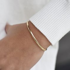 "14K solid gold cuff bracelet The bracelet will be shipped in a gift box * 14K solid gold. It is about 3.25mm width. Please select the size of your wrist.  If your wrist is 6\", please purchase a 6.25\" or 6.5\"bracelet. (If you order a 6\" bracelet, actual cuff length will be 5\" plus 1 inch opening.)" Luxury Adjustable Minimalist Cuff Bracelet, Elegant Gold Open Cuff Bracelet, Minimalist Gold Bracelet With Polished Finish For Everyday Luxury, Minimalist Polished Gold Bracelet For Everyday Luxury, Timeless Gold Cuff Bracelet For Everyday Wear, Minimalist Gold Bracelet With Polished Finish, Everyday Gold Timeless Cuff Bracelet, Yellow Gold Open Cuff Bangle For Formal Occasions, Minimalist Yellow Gold Bracelet For Everyday Luxury