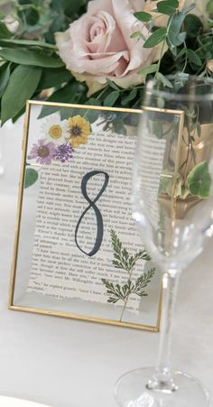 Wedding table numbers in a gold floating clasp frame with a Jane Austen book page & dried flowers pressed inside. Pressed Flower Table Numbers, Pressed Flower Table, Bookish Wedding, Flower Table Numbers, Flower Table, Future Wedding Plans, Garden Party Wedding, Wildflower Wedding, Whimsical Wedding