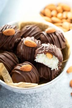 chocolate covered almonds in a bowl with nuts