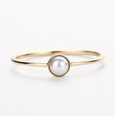 Pearl Engagement Ring Antique Vintage Women Wedding Akoya pearl Simple Minimalist Solitaire Unique Bridal Jewelry Anniversary Gift for her PRODUCT SPECIFICATIONS Handmade item -Metal Type:Yellow Gold,White Gold,Rose Gold,(14K or 18K) -Akoya Pearl carat: 3.6mm -Shape: Round -1.1mm(thickness) 1mm(width) -Ring Head Height:4mm -RIng front size:4.4mm -Total Weight: 1g Ring Size: We can make the ring in any ring size,If the ring size is not in the list,contact us,we'll custom make it for you! -See mor Diamond Alternative Engagement Ring, Unique Bridal Jewelry, Engagement Ring Antique, Alternative Wedding Rings, Silver Wrap Ring, Pearl Engagement Ring, Baguette Diamond Rings, Wedding Rings Halo, Diamond Alternatives