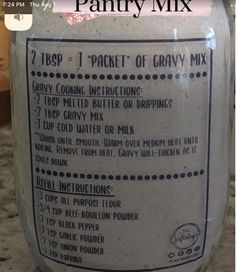 a jar with ingredients labeled in it sitting on a counter