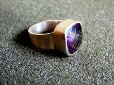 Beautiful women's statement ring. It is made completely out of sterling silver (aka silver 925 each piece is stamped, with a stunning amethyst stone in its center...------> If you do not know, or you are not sure about your ring size, the ring will be adjustable<----------->A useful guide to help you determine your ring size: http://www.ringsizes.co/ <------ Modern Silver Amethyst Gemstone Ring, Modern Sterling Silver Amethyst Ring With Polished Finish, Modern Sterling Silver Amethyst Ring, Silver Amethyst Rings With Faceted Detail, Modern Sterling Silver Amethyst Ring For Formal Occasions, Minimalist Silver Amethyst Ring, Silver Amethyst Jewelry With Bezel Setting, Silver Faceted Amethyst Ring As Gift, Silver Polished Amethyst Ring