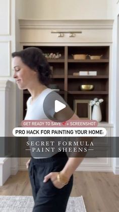 a woman standing on top of a rug in front of a book shelf with the words pro hack for painting your home