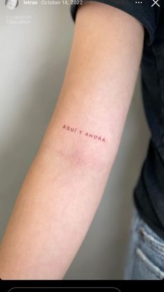 a woman's arm with the word aout anora written in red ink