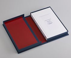 an open box with a red and blue cover