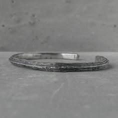 Orbit bangle- thin silver cuff bracelet with unusual hancrafted texture Bracelets Project50g Minimalist Engraved Bangle Cuff Bracelet, Minimalist Oxidized Bracelets For Everyday, Everyday Minimalist Oxidized Bracelets, Minimalist Oxidized Bangle Bracelets, Minimalist Oxidized Bangle Bracelet, Minimalist Hand Forged Silver Cuff Bracelet, Minimalist Hand-forged Silver Cuff Bracelet, Minimalist Handmade Cuff Bangle Bracelet, Handmade Minimalist Cuff Bangle Bracelet