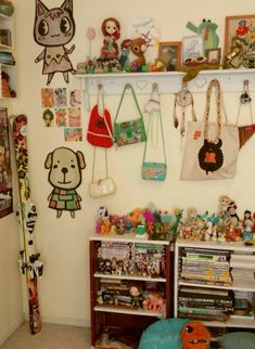 a room filled with lots of toys and stuffed animals on the wall next to bookshelves