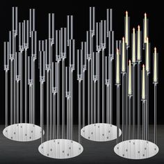 several candles are arranged in the shape of circles and poles with holes on each side