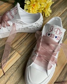 Embroidered Converse with Pearls and rhinestones on the toes, heels and scattered across the sides. Finished off with ribbon laces! I will use white ribbon laces unless you request a different color, Message me your requests as all colors are not always available (some other colors are available) Getting Married? What a great idea. This listing is for Mrs on the tongue and with date on the side ! I will use the font shown unless you message me with your requests! You choose your thread colors, I Wedding Lace-up Sneakers With Rhinestones, Wedding Low-top Sneakers With Rhinestones, Embellished Lace-up Sneakers For Weddings, Embellished Low-top Wedding Sneakers, Lace-up Pink Wedding Shoes, Pearl Embellished Lace-up Wedding Sneakers, Lace-up Sneakers With Rhinestones For Anniversary, Low-top Wedding Shoes With Rhinestones For Bride, Low-top Bride Wedding Shoes With Rhinestones