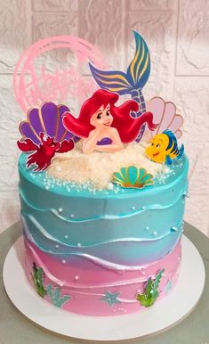 the little mermaid cake is decorated with fondant