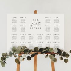 a table plan with eucalyptus leaves and greenery