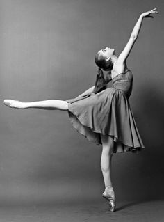 a black and white photo of a ballerina