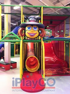 an inflatable play area for children with clown face and hat on the top