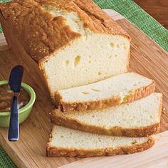 sliced loaf of bread sitting on top of a cutting board