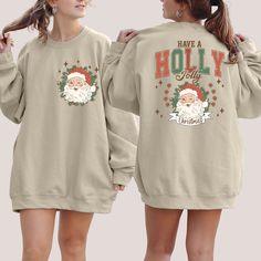 Retro Santa Have A Holly Jolly Christmas Sweatshirt,Back And Front shirt,Cute Santa Sweater, Santa Claus Shirt, New Year Shirt,Christmas Tee Welcome to Bee Design Gifts If you are looking for soft, comfy, first-rate sweatsuits, you're in the right place! I love what I do and strive to make your shopping experience just right for you. If you have any questions, concerns or comments about my products, feel free to send a message anytime. ⭐ 50% cotton, 50% polyester ⭐ Pre-shrunk ⭐Classic fit ⭐ 1x1 athletic rib knit collar with spandex ⭐ Air-jet spun yarn with a soft feel and reduced pilling ⭐Double-needle stitched collar, shoulders, armholes, cuffs, and hem HOW TO PLACE ORDER 1. Check photos for size chart, model comparison and color options 2. Select size and color from the drop down options Cute Long Sleeve T-shirt For Holiday, Cute Long Sleeve Holiday T-shirt, Relaxed Fit Long Sleeve T-shirt For Holiday, Relaxed Fit Long Sleeve Holiday T-shirt, Have A Holly Jolly Christmas, Santa Sweater, New Year Shirt, Holly Jolly Christmas, Retro Santa