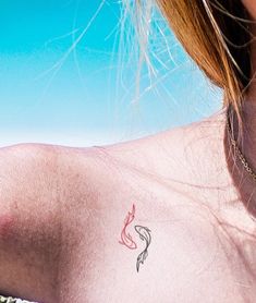 a woman with a small tattoo on her chest