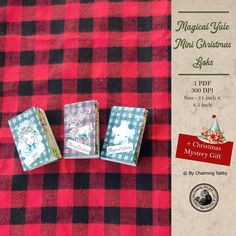 three miniature christmas cards sitting on top of a red and black checkered table cloth