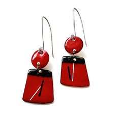 pair of red and black earrings on white background