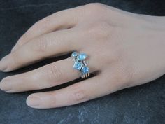 This beautiful stackable set of solitaire rings is sterling silver with blue topaz gemstones. The topaz measure 3mm, 4mm, 4x6mm and 5x5mm. Size: 6 Marks: JGD, 925 JGD is the hallmark for Janice Girardi Condition: Excellent Stackable Blue Topaz Ring For Promise, Stackable Blue Topaz Ring For Anniversary, Blue Topaz Stackable Promise Ring, Blue Topaz Stackable Ring For Promise Occasions, Anniversary Stackable Blue Topaz Ring, Silver Stackable Blue Topaz Ring, Stackable Silver Blue Topaz Ring, Silver Blue Topaz Stackable Ring, Costume Rings