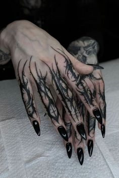 Looking for a dramatic tattoo for women? A dark Gothic hand tattoo makes a statement with its intricate details and bold placement. This tattoo for female body art fans is not only eye-catching but also a perfect fit for those looking to add a unique, dark-themed tattoo to their collection. Gotik Tattoo, Satanic Tattoos, Vampire Tattoo, Goth Tattoo, Kunst Tattoos, Tattoo Magazine, Wicked Tattoos, Geniale Tattoos