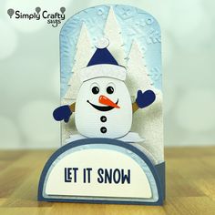 a close up of a card with a snowman on it's face and the words let it snow