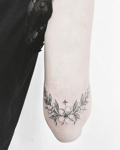 a woman with a tattoo on her arm