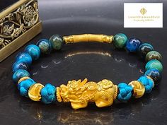 Gift yourself or your loveonce this exquisite Pure Gold Pixiu Bracelet.  *Materials: Au999 Pure Gold, Tigers Eye and Chinese Knot. *Bracelet Weight: Approximately 15g *Karat: 24K Pure Gold  *Gold Color: Yellow *Gold Weight: Approximately 3.90g *Cats Eye Gold Ball: Approx. 8mm *Stone Size: Approximately 8mm 🧧Pi Xiu is capable of warding off evil spirits, bringing good fortune and wealth. ●NOT GOLD FILLED. NOT GOLD PLATED. NOT GOLD VERMEIL.  Metal is made of Real 24 Karat Gold . 📬S H I P P I N G Gold Hand-strung Crystal Bangle Bracelet, Spiritual Yellow Gold Beaded Bracelets As Gift, Spiritual Gold Bracelet With Round Beads As Gift, Yellow Gold Bangle Beaded Bracelet Gift, Yellow Gold Beaded Bangle Bracelet Gift, Luxury Gold Bracelet With Round Beads For Gift, Gold Bracelets With Round Beads For Good Luck, Yellow Gold Hand-strung Bracelet As Gift, Gold Spiritual Wristband With Round Beads