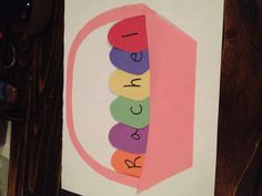 an easter card with the word rachel spelled in colorful eggs on it's side