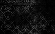 black and white grungy wallpaper with an ornate design