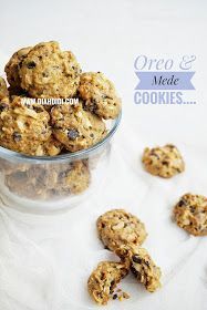 oatmeal cookies in a glass bowl on a white tablecloth with the words oreo & mede cookies