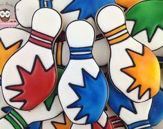 decorated cookies in the shape of bowling pins