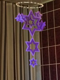 some purple snowflakes hanging from the ceiling