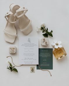 wedding stationery with shoes, perfume and flowers