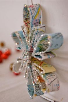 a paper snowflake is hanging on the wall