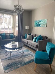 a living room filled with furniture and a chandelier