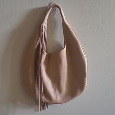 Stylish Luxury Handbag In Camel. Never Used. Lots Of Space, One Zippered Pocket And One Open Pocket. Fun Fringe Accent And Wrapped Shoulder Strap. Real Pebble Leather. On Trend For The Fall. Condition Is Like New, Clean Interior, No Visible Flaws. Beige Hobo Bag With Handle Drop For Everyday Use, Beige Hobo Bag For On-the-go, Camel Hobo Bag With Double Handle For Shopping, Camel Hobo Tote Bag With Adjustable Strap, Beige Hobo Bag With Handle Drop For Daily Use, Beige Pouch Hobo Bag For On-the-go, Camel Double Handle Hobo Bag For Shopping, Beige Hobo Shoulder Bag With Handle Drop, Camel Hobo Bag With Removable Pouch