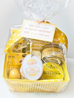 a yellow basket filled with lemons and other items that include soap, lotion